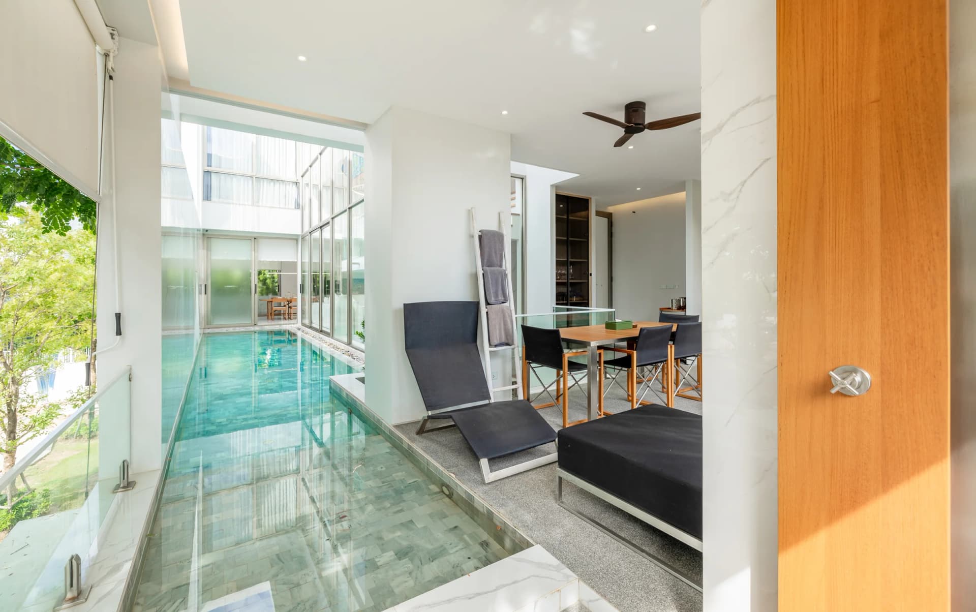 Pool terrace on the first floor: the pool runs on under a walk-on glass deck